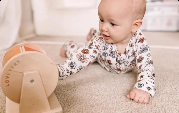 Baby with the Rainbow Spinner from The Senser Play Kit