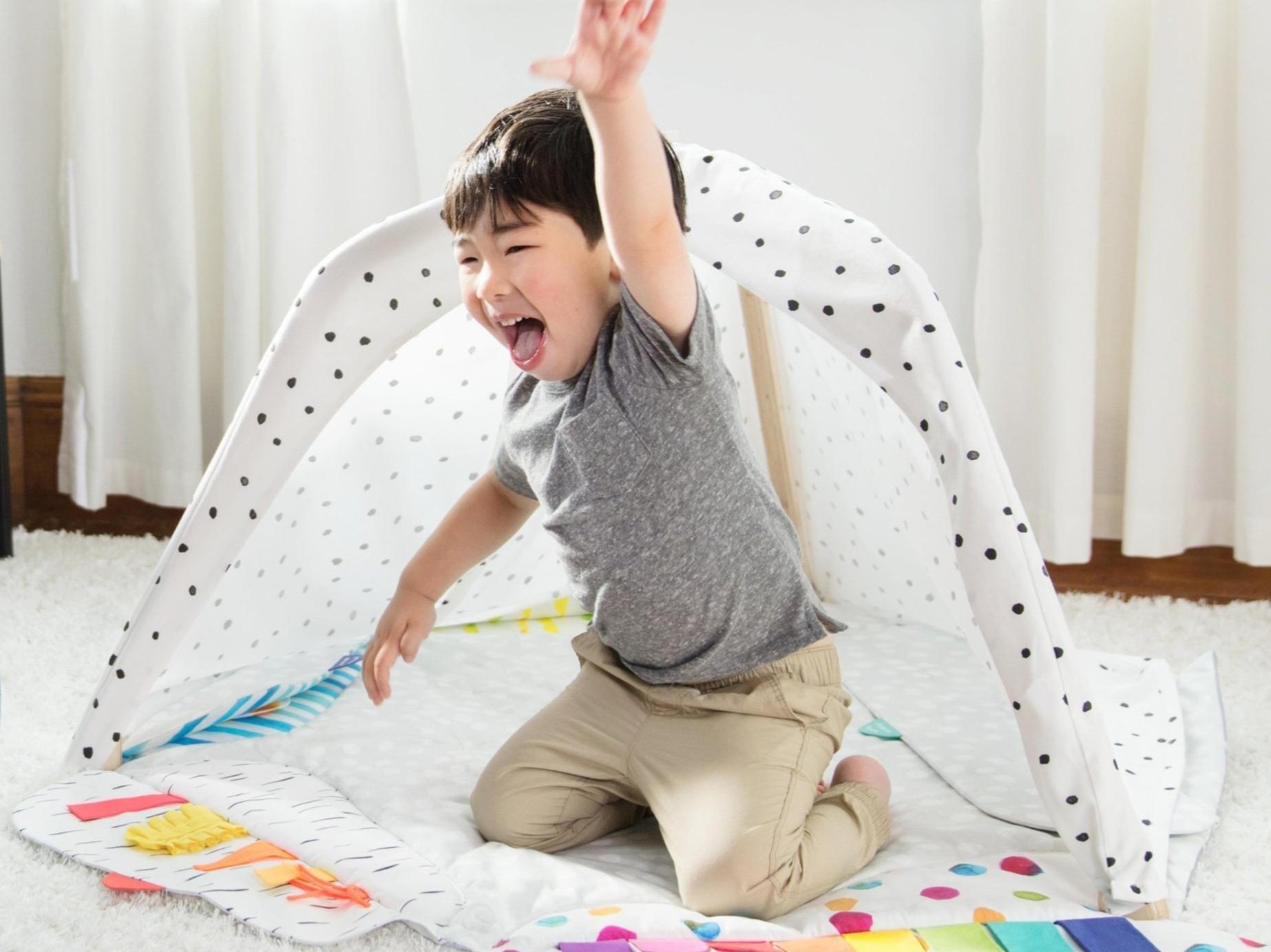 Toddler on The Play Gym by Lovevery