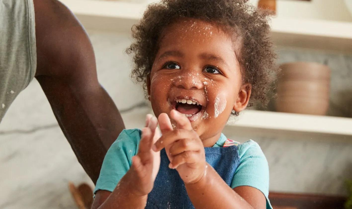 Child with flour on their face