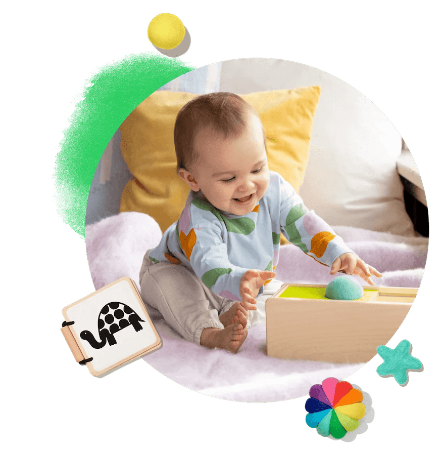 Baby playing with toys from The Play Kits by Lovevery